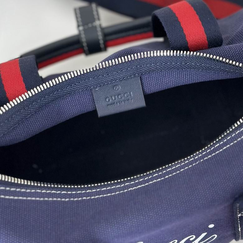 Gucci Pre-Owned Crest Printed Canvas Duffle Bag in blue canvas