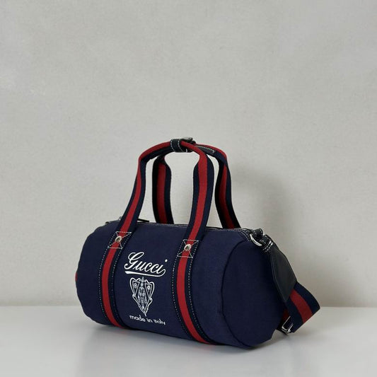 Gucci Pre-Owned Crest Printed Canvas Duffle Bag in blue canvas